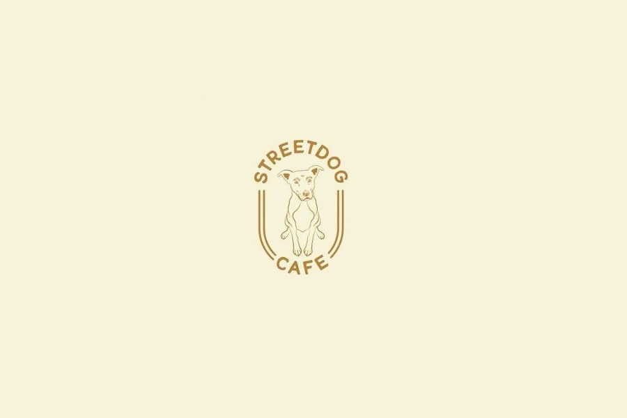 A minimalist logo for Streetdog Cafe featuring a line drawing of a dog in McLennan County, Texas.