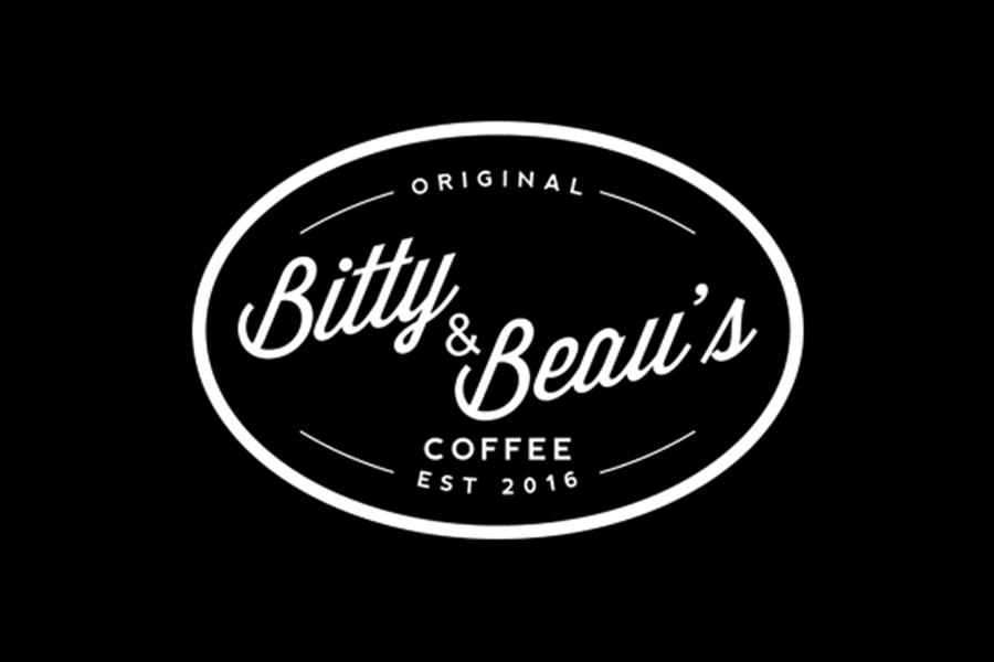 The white logo for Bitty & Beau's Coffee on a black background in McLennan County, Texas.