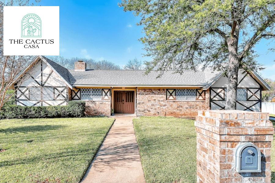 A single-story brick house with Tudor-style trim and a front walkway in McLennan County, Texas.