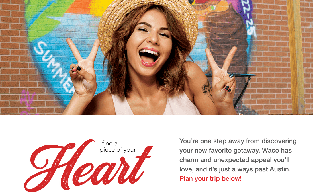 A smiling woman in a straw hat makes peace signs in front of graffiti in McLennan County, Texas.