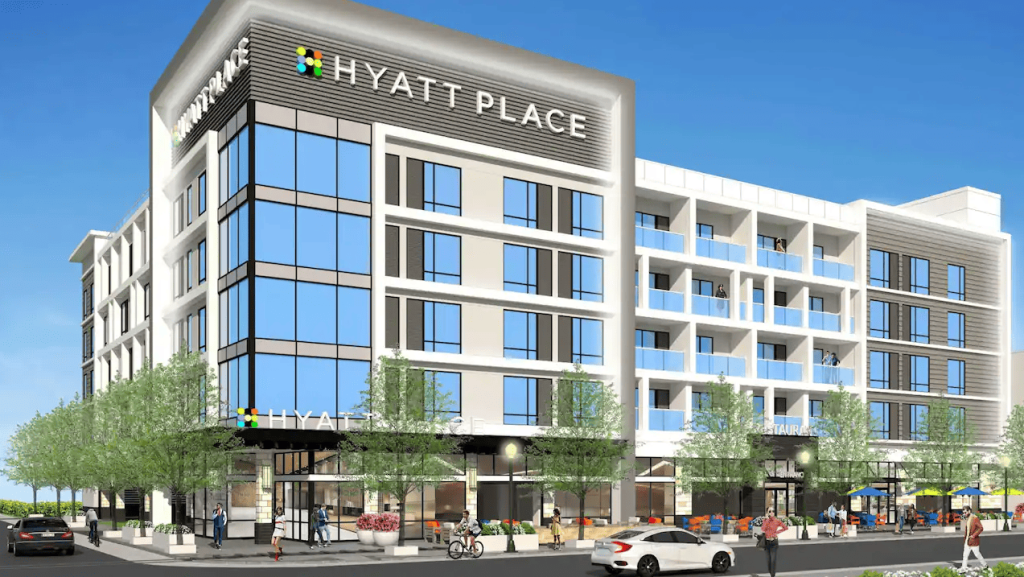 A modern Hyatt Place hotel building with glass windows and balconies on a sunny day in McLennan County, Texas.