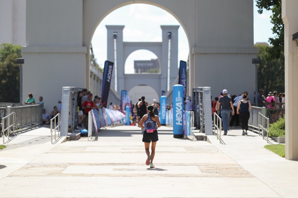 A runner jogs across a bridge during a race event in McLennan County, Texas.