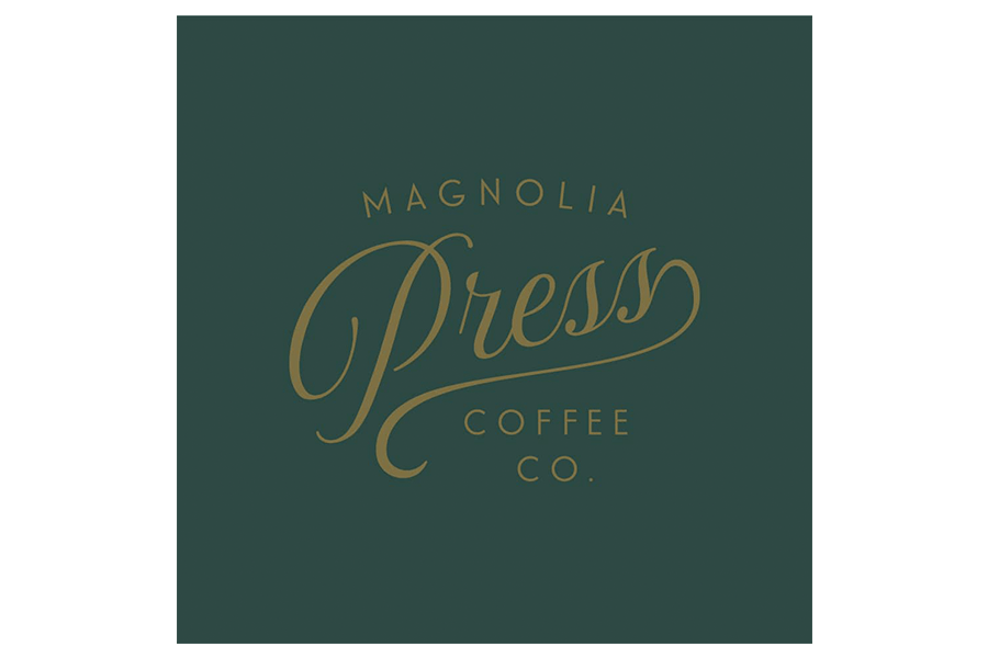 The logo for Magnolia Press Coffee Co. featuring gold text on a dark green background in McLennan County, Texas.