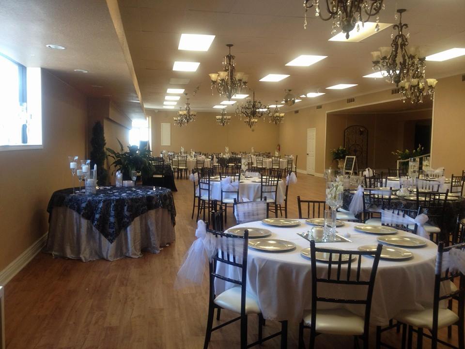 A spacious banquet hall set up for a formal event with round tables in McLennan County, Texas.
