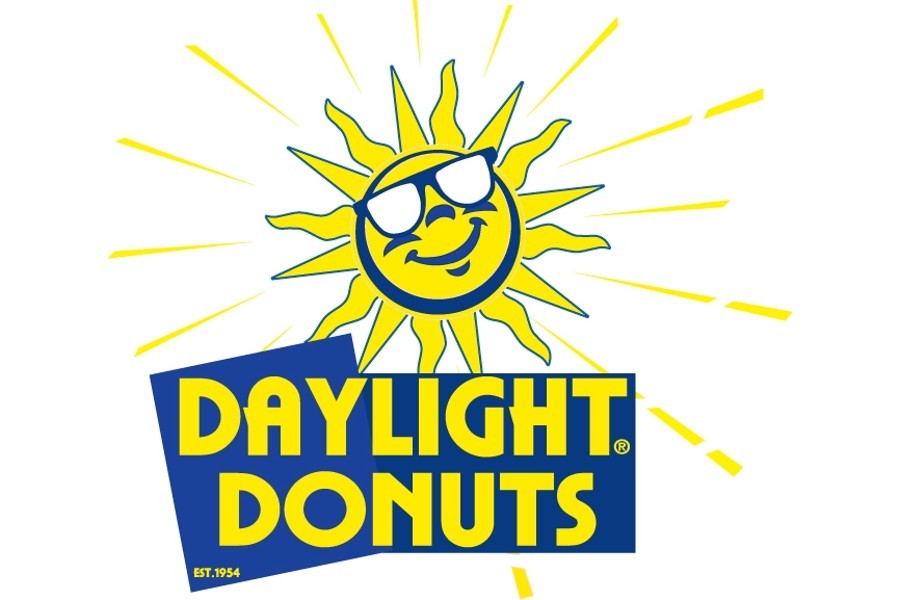 The logo for Daylight Donuts featuring a smiling sun wearing sunglasses in McLennan County, Texas.