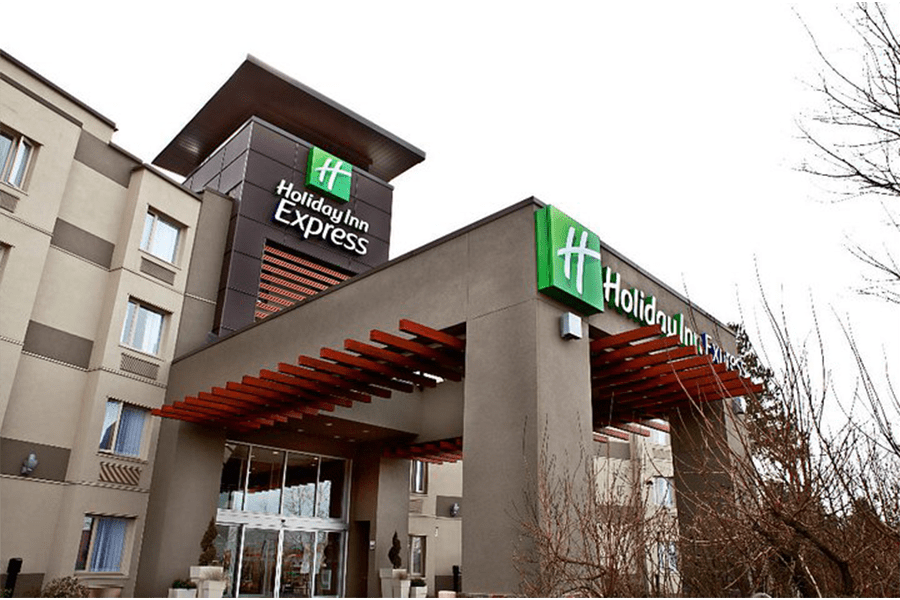 The exterior entrance of a Holiday Inn Express hotel building in McLennan County, Texas.