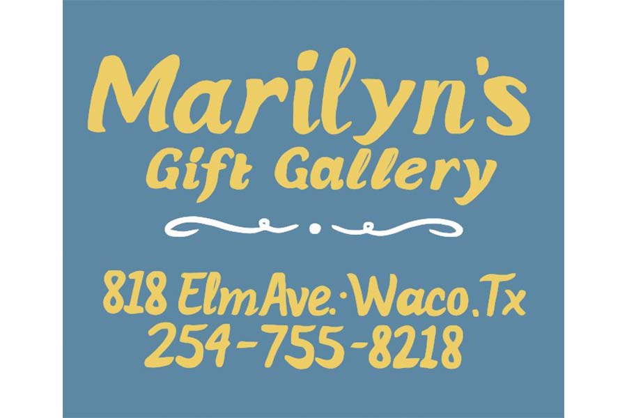 A blue sign with yellow text reading Marilyn's Gift Gallery and address information in McLennan County, Texas.