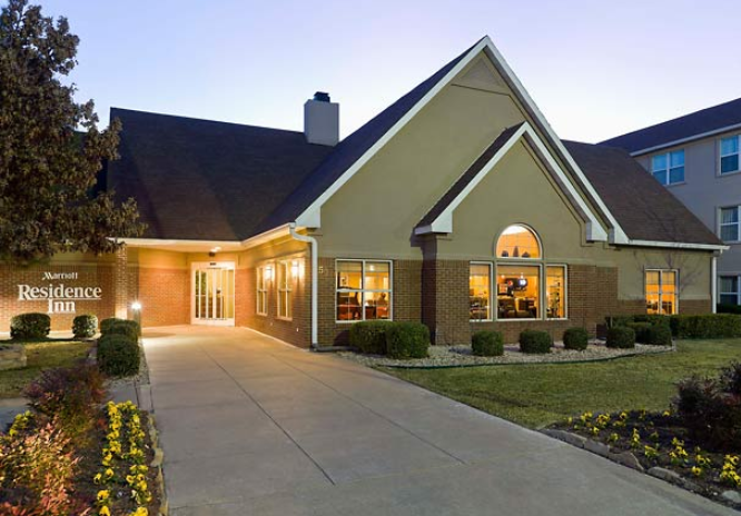 The exterior of a Residence Inn hotel building at dusk with illuminated windows in McLennan County, Texas.