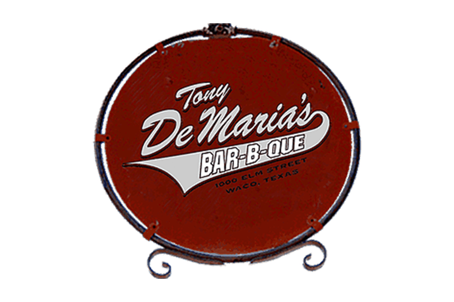 A circular red sign for Tony De Maria's Bar-B-Que in Waco, Texas in McLennan County, Texas.