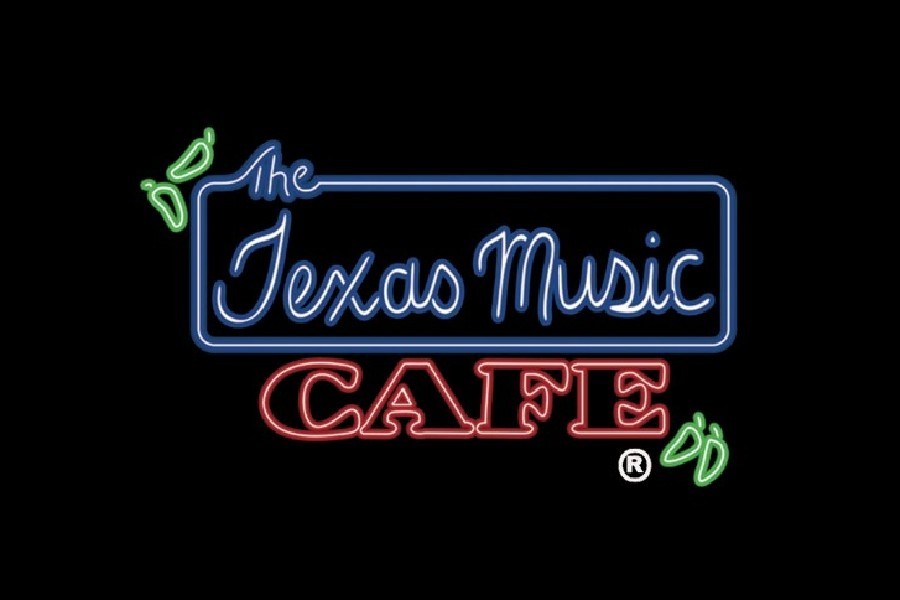 A neon sign for The Texas Music Cafe with green chili pepper accents in McLennan County, Texas.