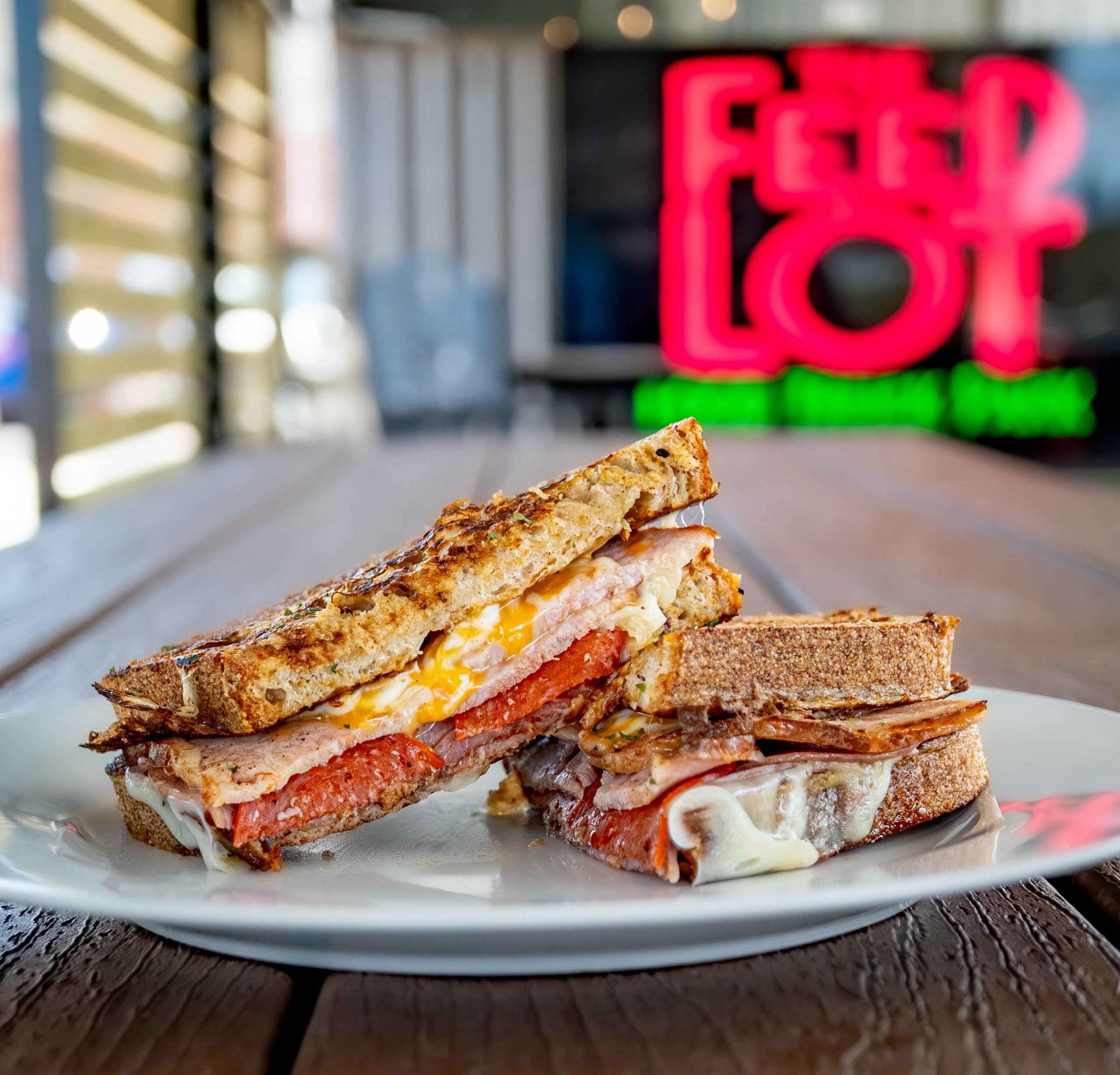 A grilled ham and cheese sandwich on a white plate in McLennan County, Texas.
