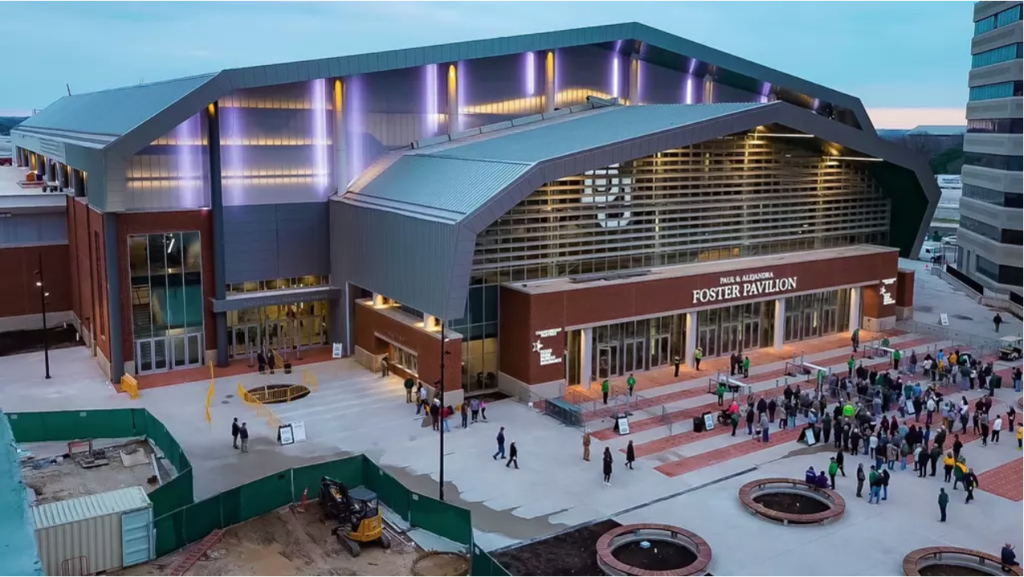 An aerial view of the Foster Pavilion arena with people gathering outside at dusk in McLennan County, Texas.