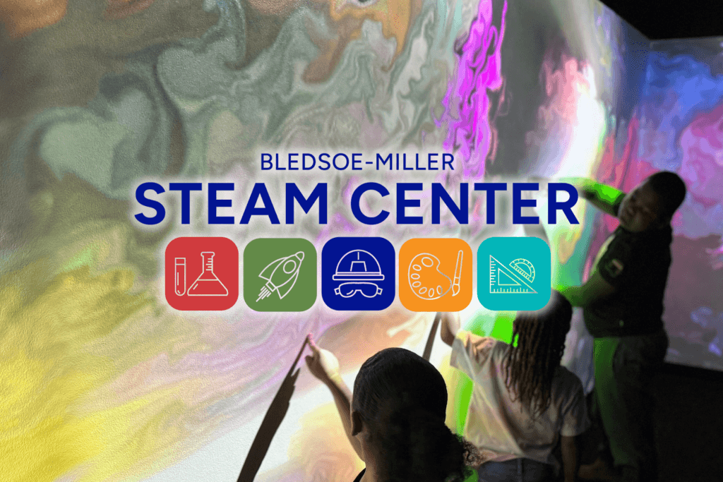 Children interact with a colorful, projected digital display at the Bledsoe-Miller STEAM Center in McLennan County, Texas.