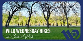 A group of people hiking along a path near trees and a river in McLennan County, Texas.