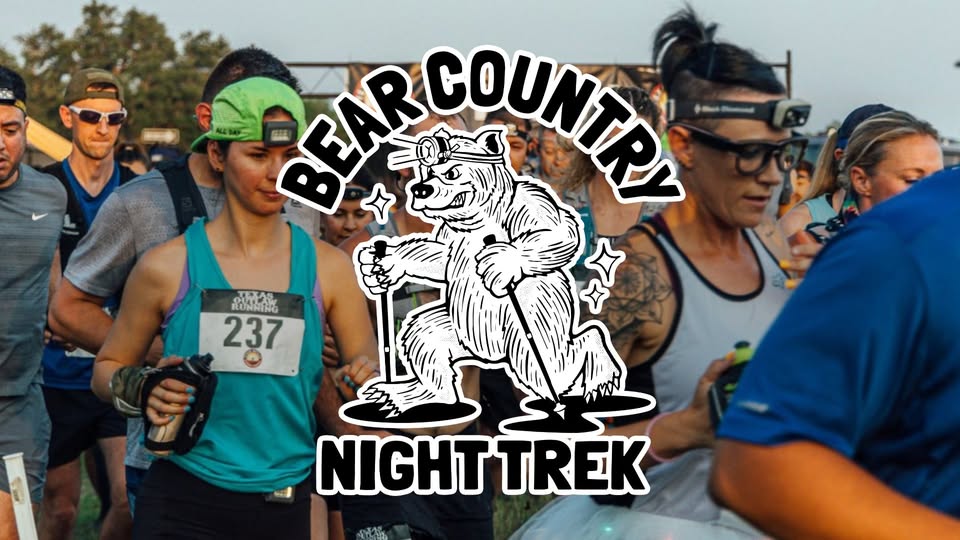 A group of runners participating in a night trail race in McLennan County, Texas.