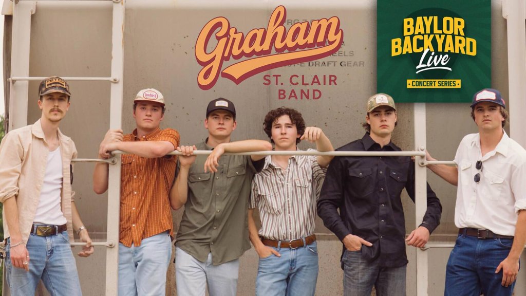Six young men in casual attire pose in front of a train car in McLennan County, Texas.