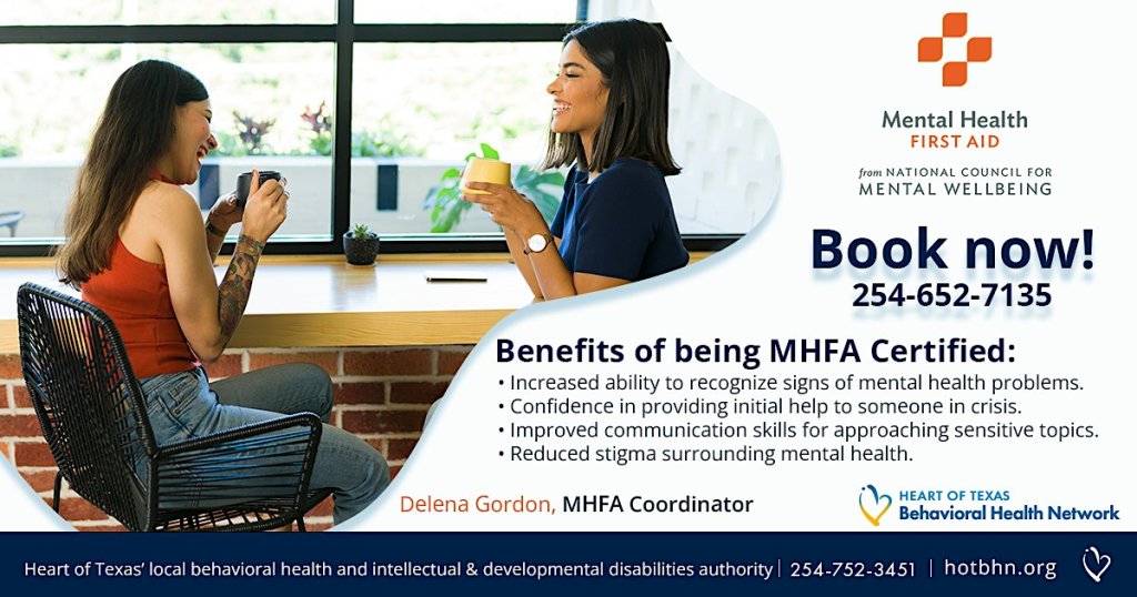 Two women smiling and drinking coffee while discussing Mental Health First Aid certification in McLennan County, Texas.